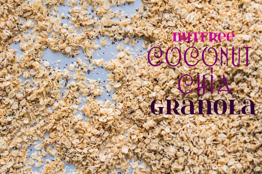 Nutfree Coconut Chia Granola laid out on a sheet pan with text overlay.