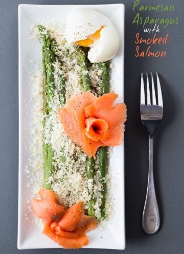 Top view of Parmesan Asparagus with Smoked Salmon on rectangular plate with a fork and text overlay.
