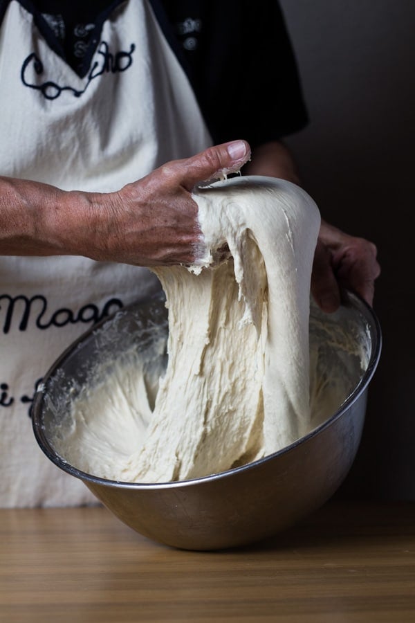 Bread dough hand kneading for authentic German Bread