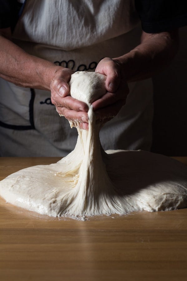 Lifting loafs of sticky dough for German Bread