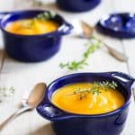 smooth butternut squash soup in blue soup bowls