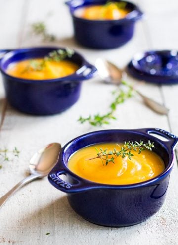 smooth butternut squash soup in blue soup bowls