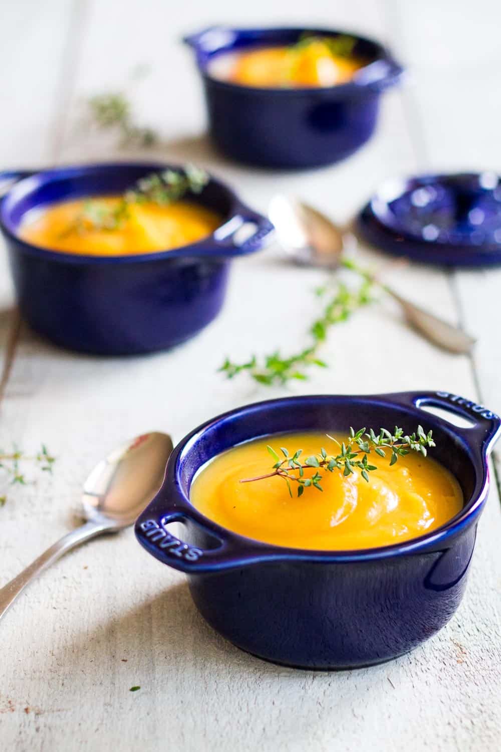 smooth butternut squash soup in blue soup bowls