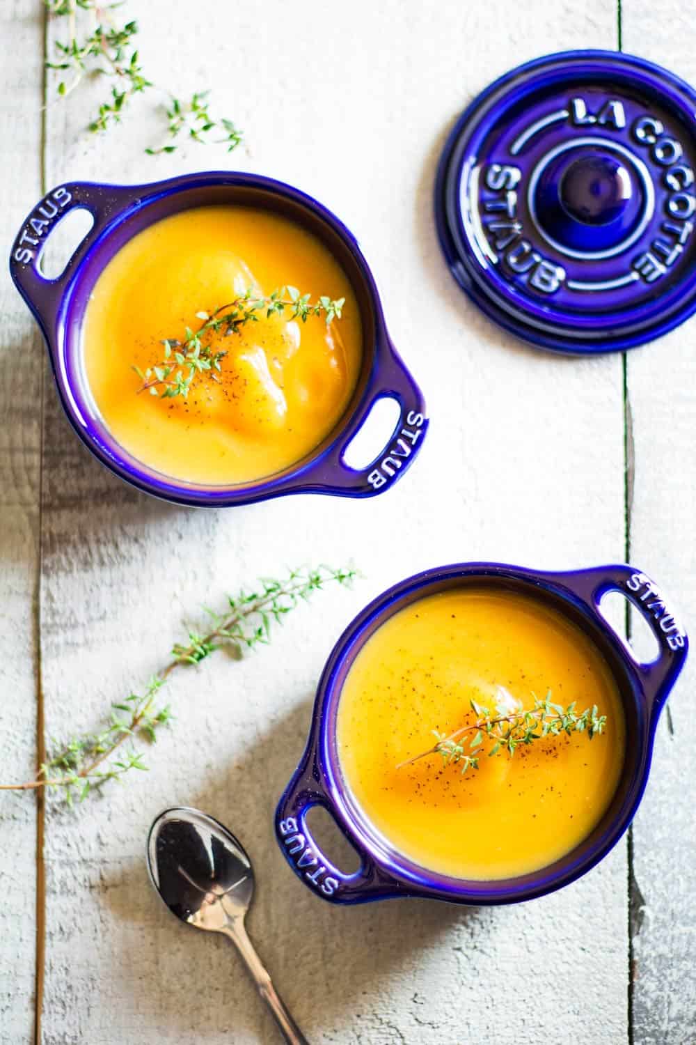smooth butternut squash soup in blue cocotte