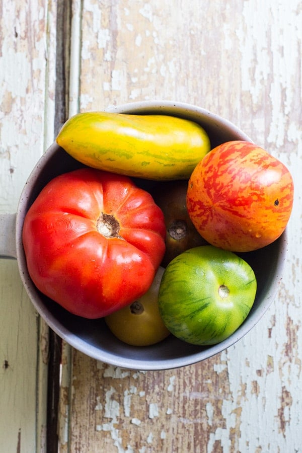A bowl with heirloom tomatoes.