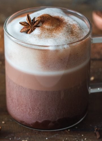 Mexican Hot Chocolate with frothed milk in a glass cup