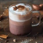 Mexican Hot Chocolate with frothed milk in a glass cup