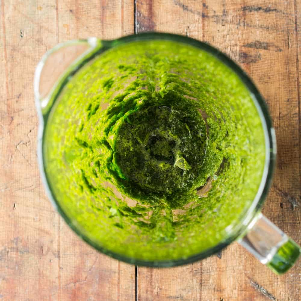 Coriander and aji sauce in a blender.