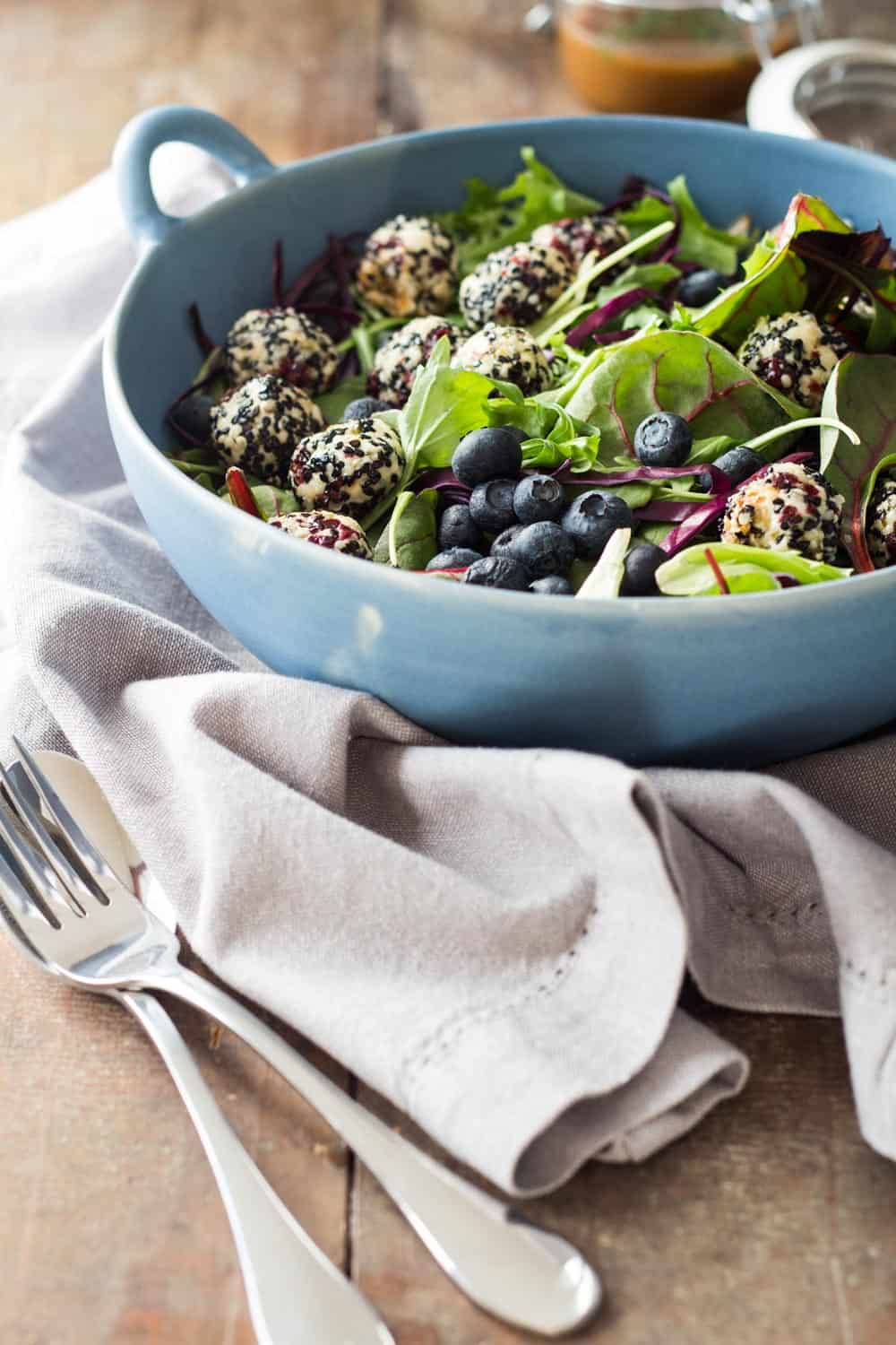 Warm Goat Cheese Salad in a blue salad bowl