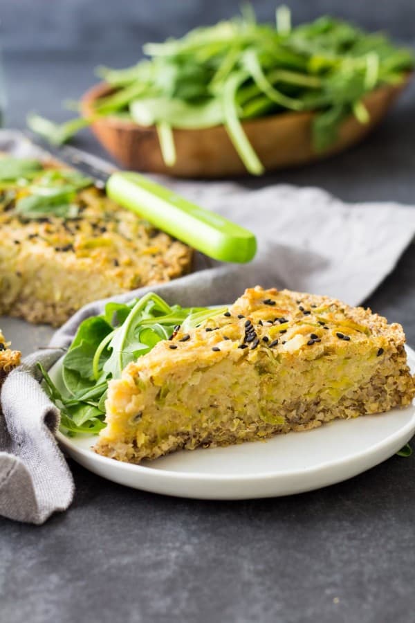 A slice of Vegan Quiche on a plate with salad.