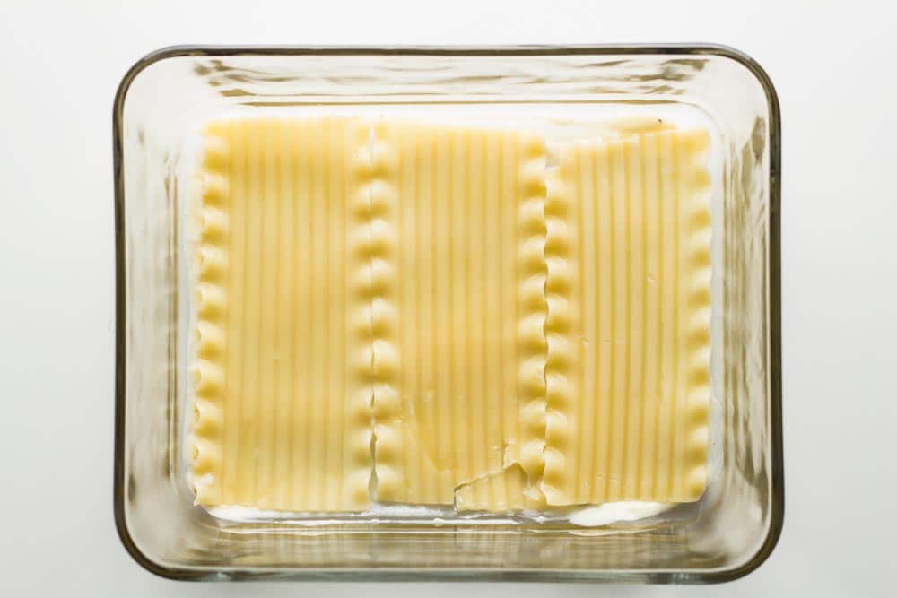 Lasagna sheets laid out in a baking dish.