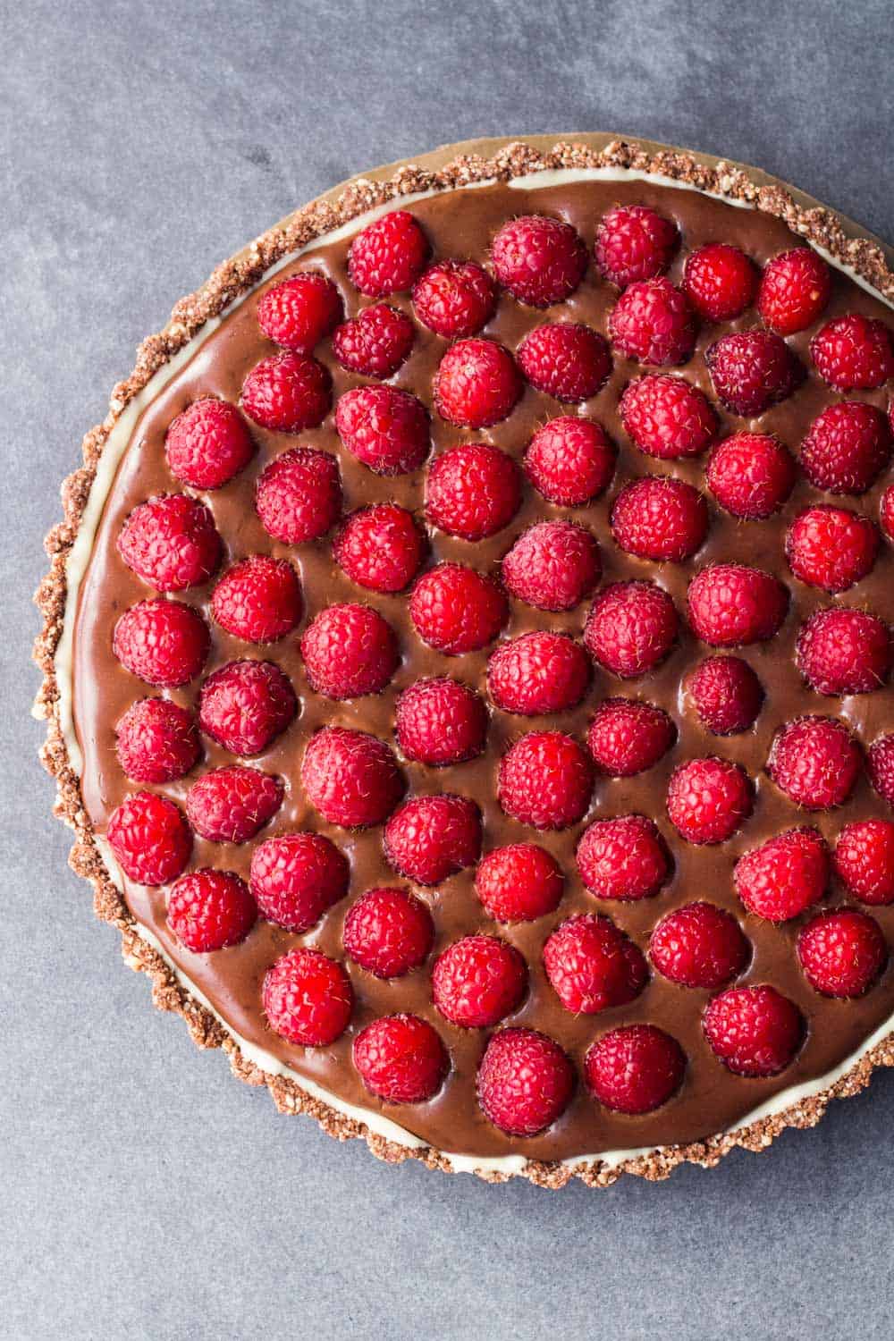 Chocolate Raspberry Tart with Almond Crust and white chocolate layer in between.