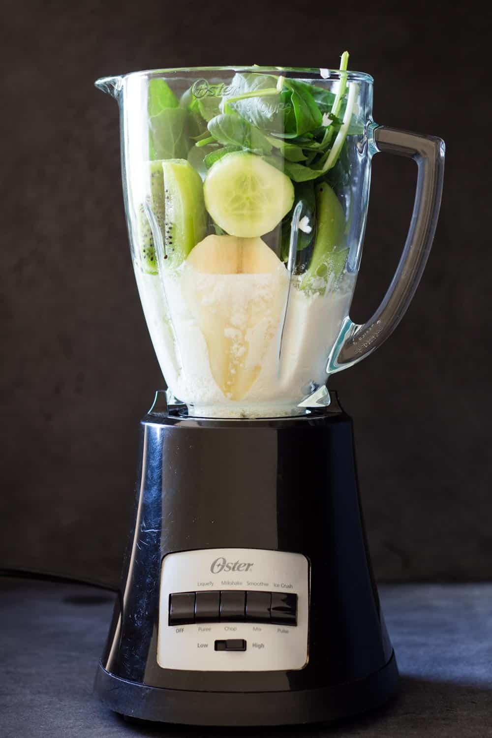 Ingredients for healthy green smoothie in blender