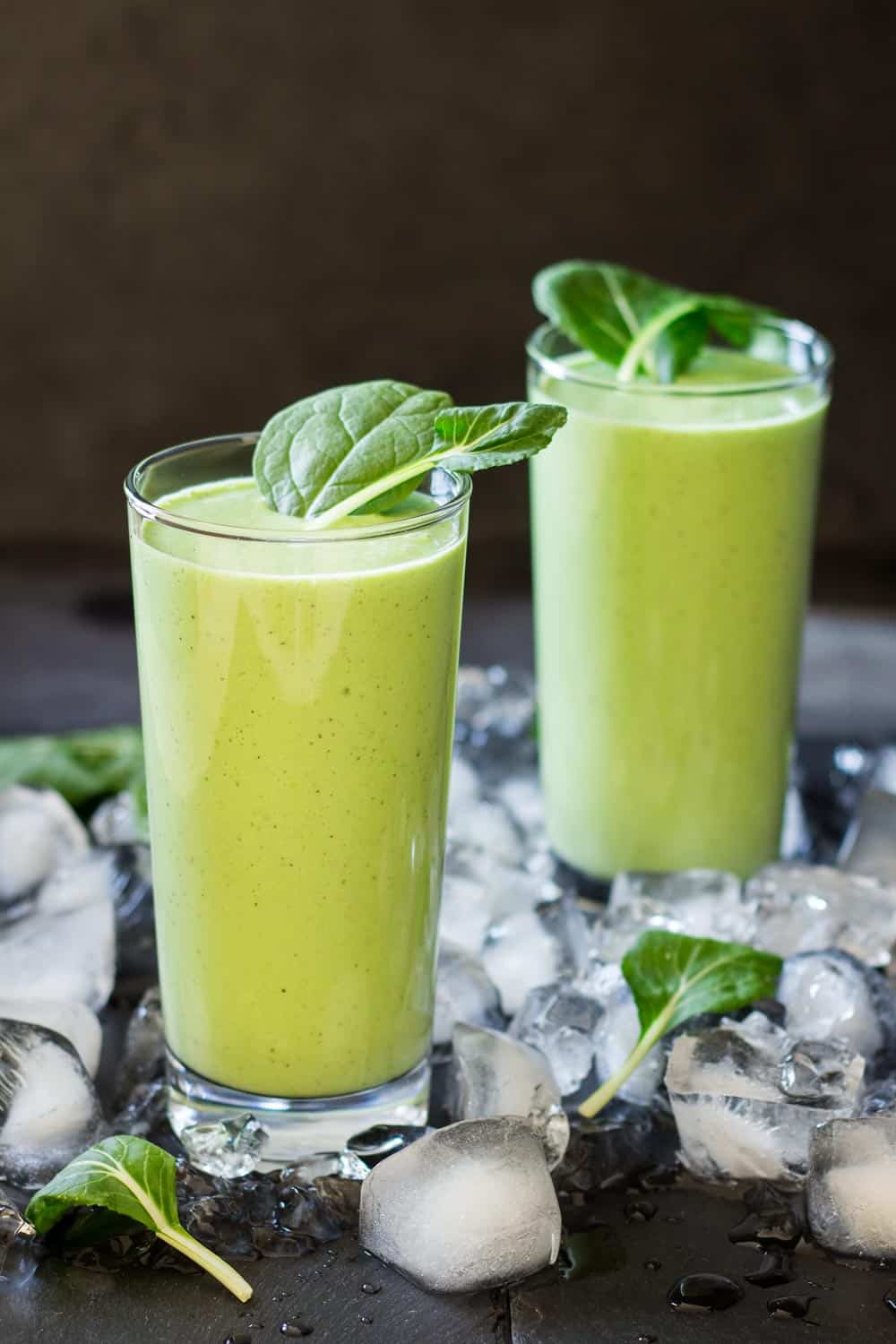 healthy green smoothie in two glasses