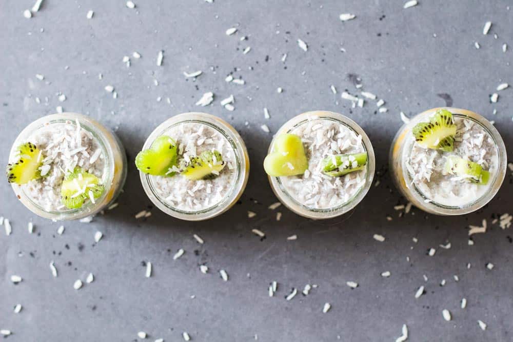 Top view of four jars of Tropical Chia Pudding.