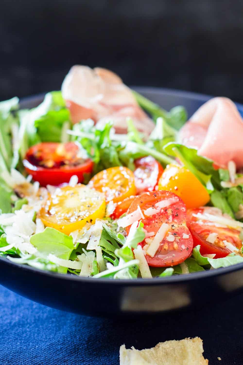 Close up of Arugula Tomato Prosciutto Salad to show texture.