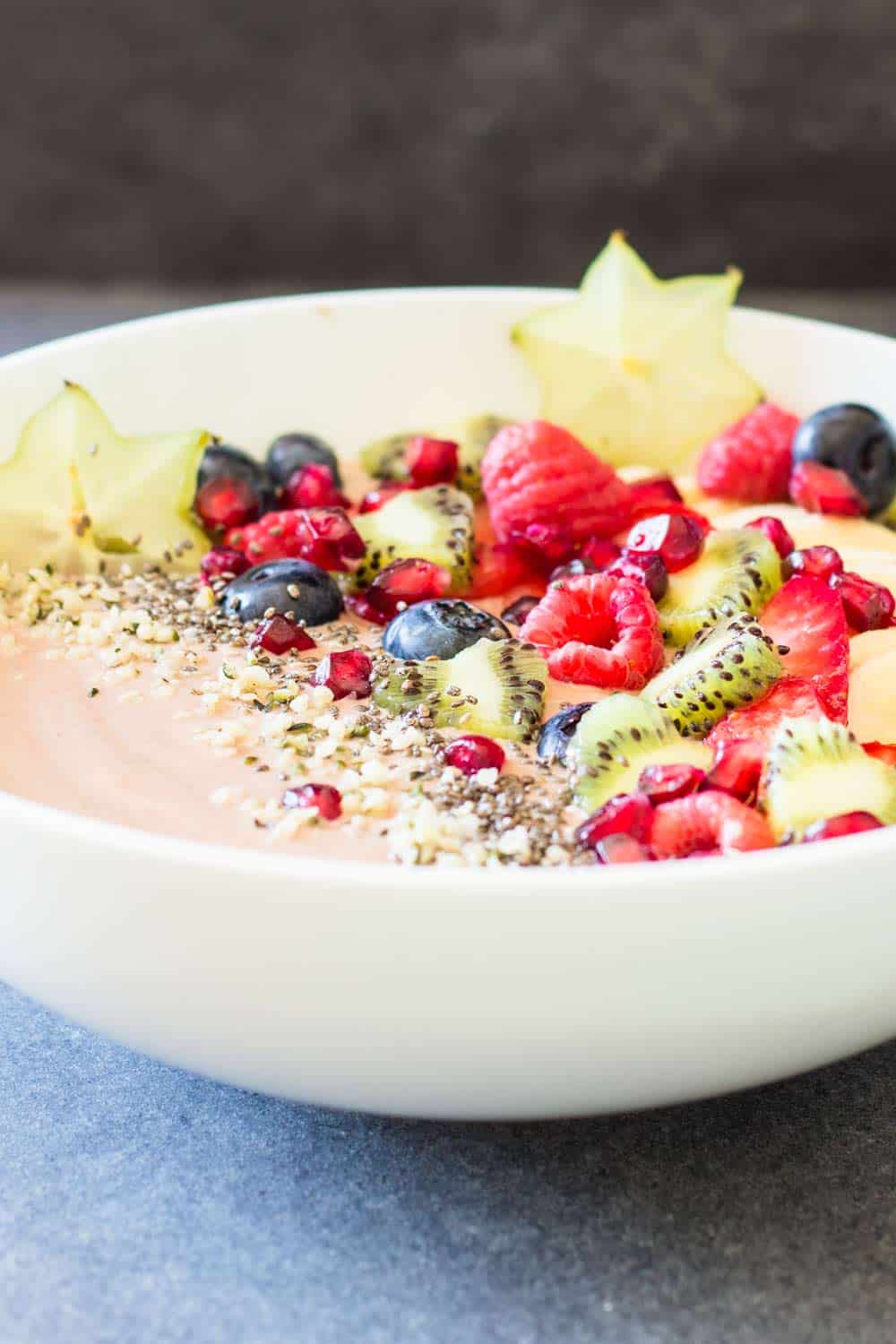 Close up of Chocolate Smoothie Bowl with chopped fresh fruit to show texture.
