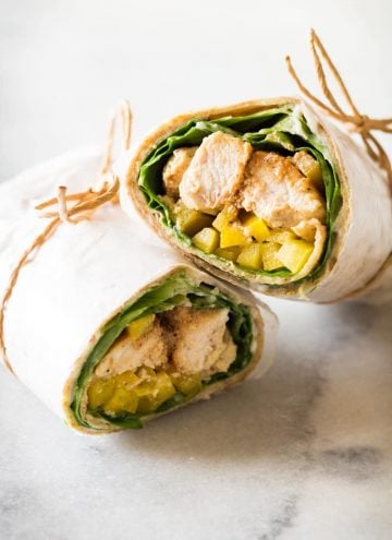 Healthy Chicken Wrap sliced in two, tied with jute twine.