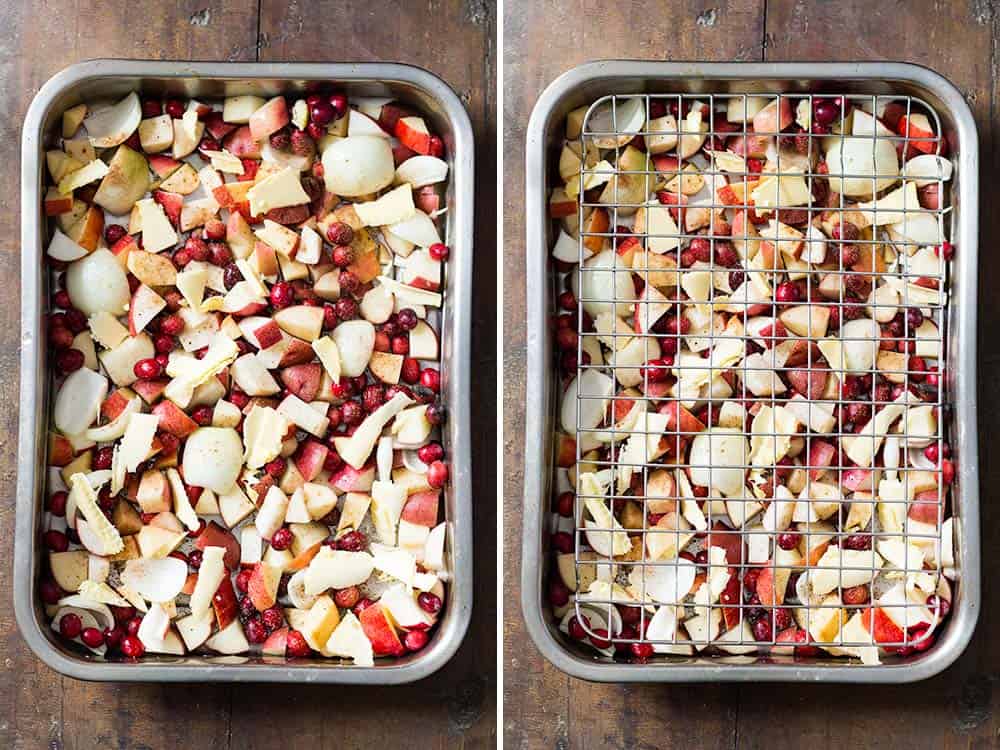 Two roasting pans with chopped raw apples, cranberries and potatoes. 