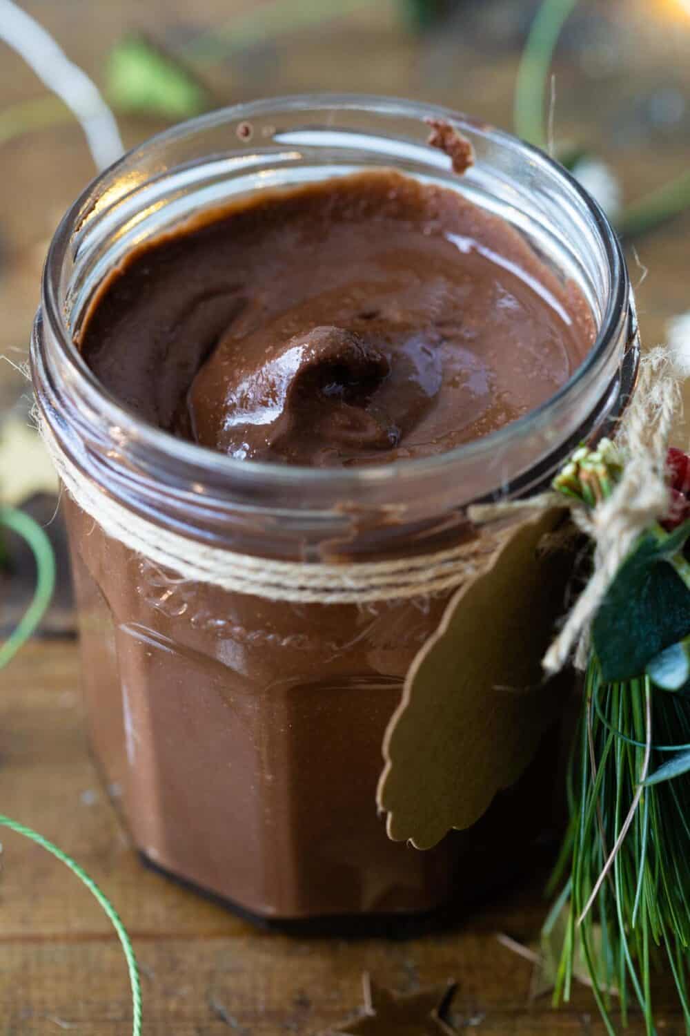 chocolate spread in a glass jar showing closeup consistency.