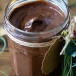 chocolate spread in a glass jar showing closeup consistency.