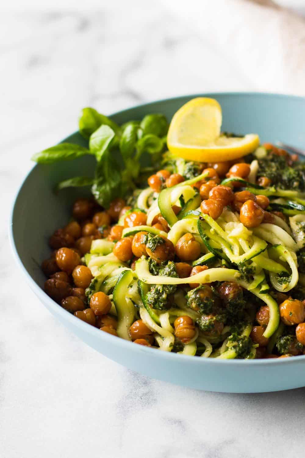 A vegan, super nutritious and Easy Zucchini Noodles Recipe filled with flavor. Spiralized Zucchini, crispy roasted chickpeas and an out of this world Tahini Herb Sauce.