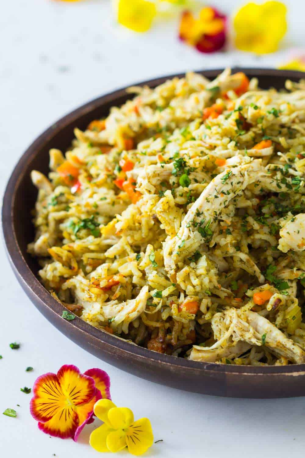 Instant Pot Chicken Breast and Rice on a wooden plate showing rice texture