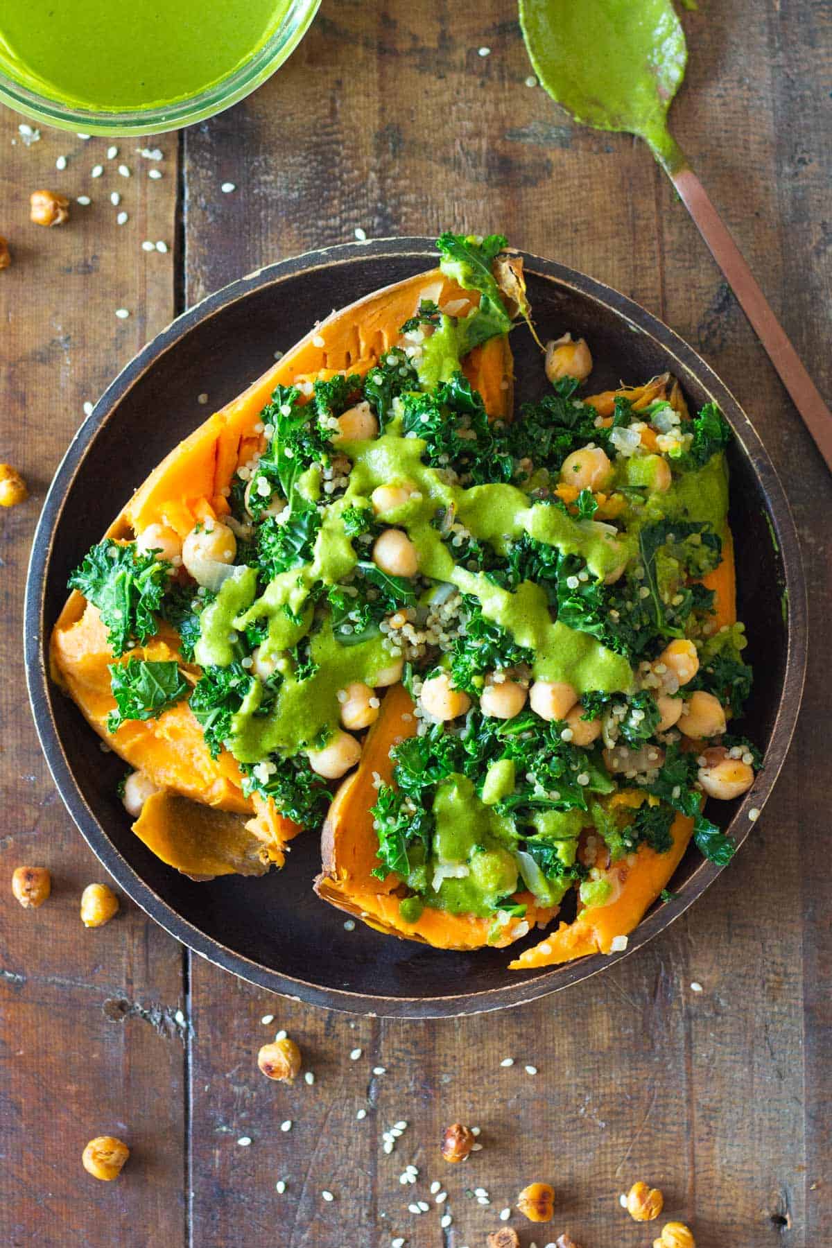 Kale Chickpea Quinoa Stuffed Sweet Potato with green sauce