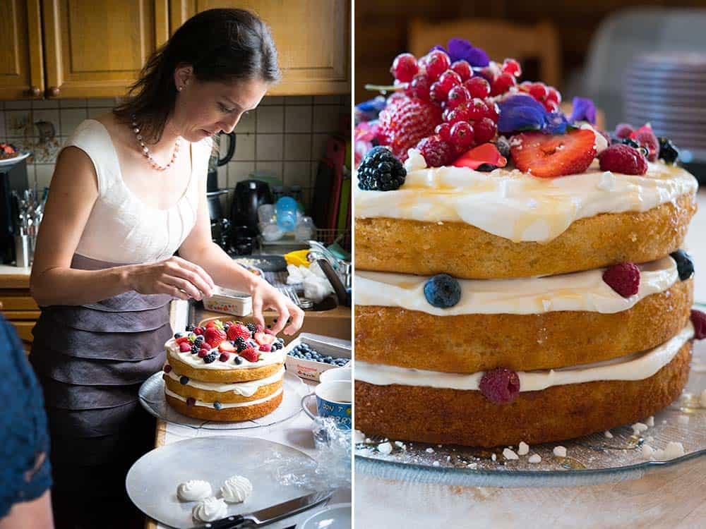 Left: woman in a kitchen decorating a three-layered cake with fresh fruit. Right: Close up of three-layered cake with white frosting topped with fresh fruit.