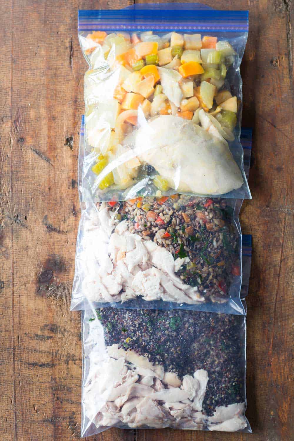 3 Easy Healthy Freezer Meals in Ziploc bag one next to the other.