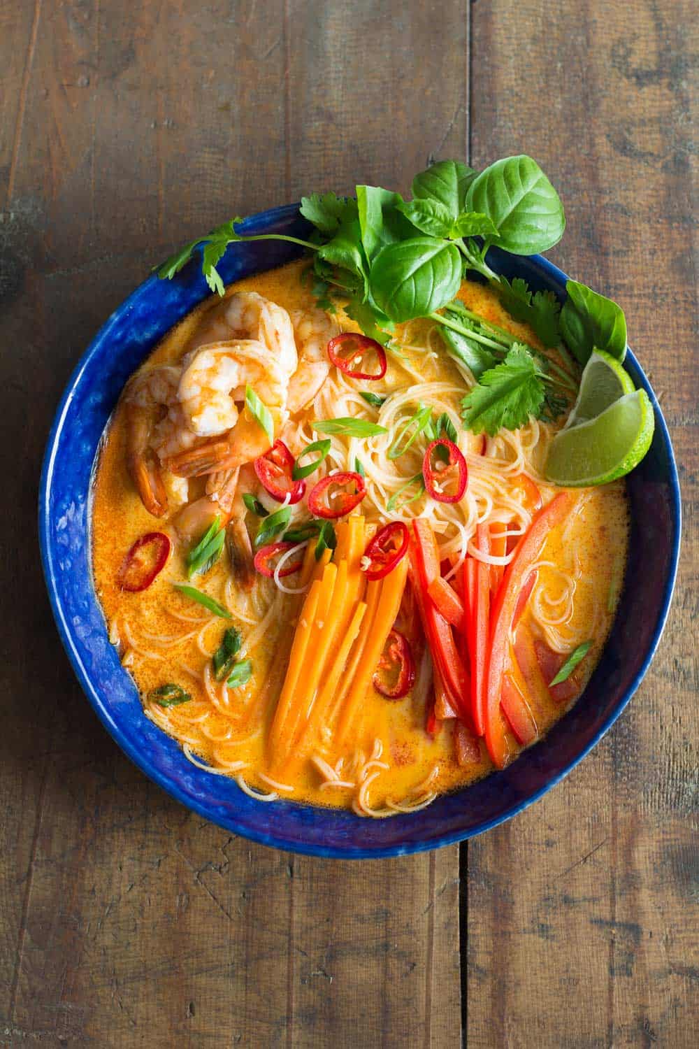 Coconut curry soup in a blue bowl