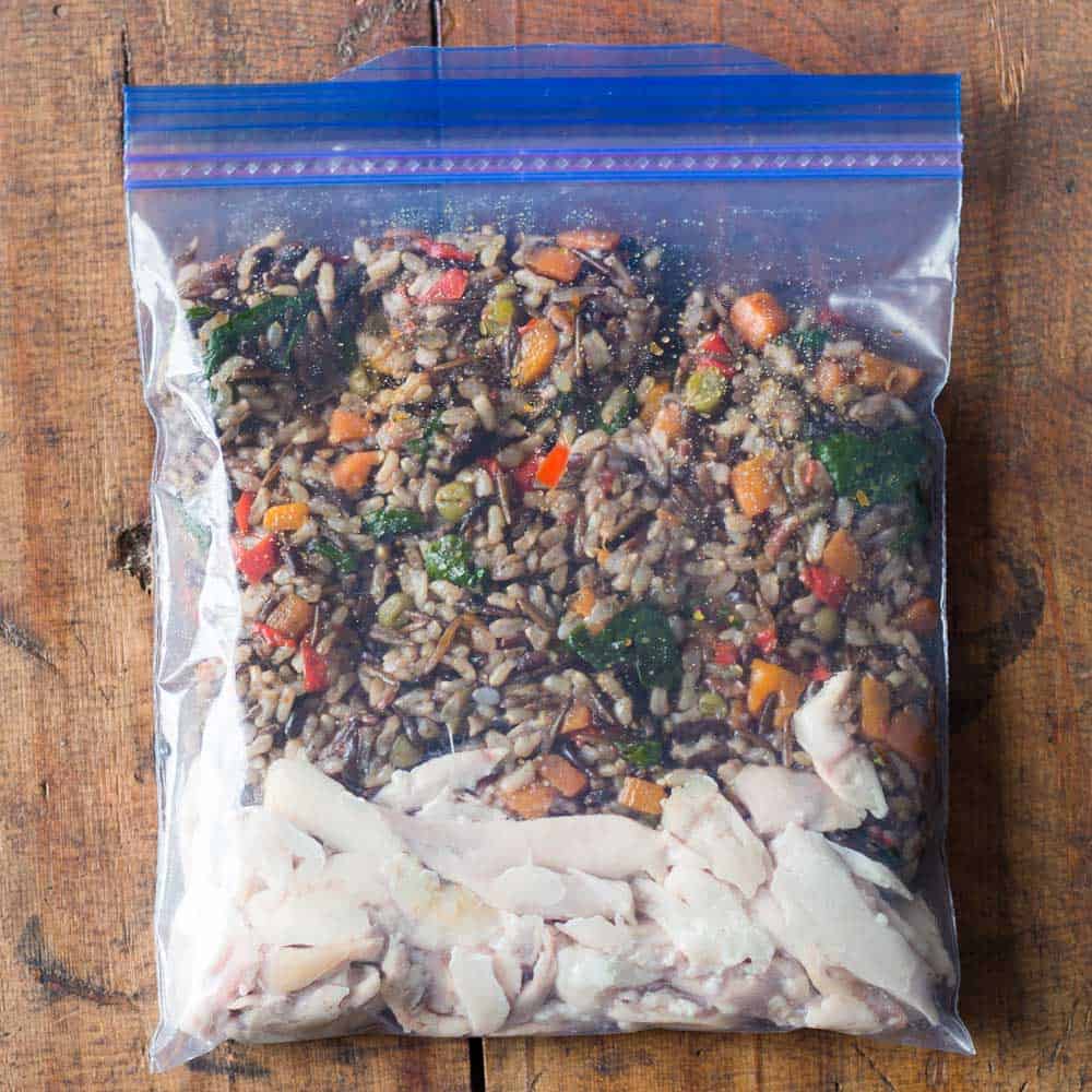 shredded chicken with wild rice blend as healthy freezer meal in Ziploc bag