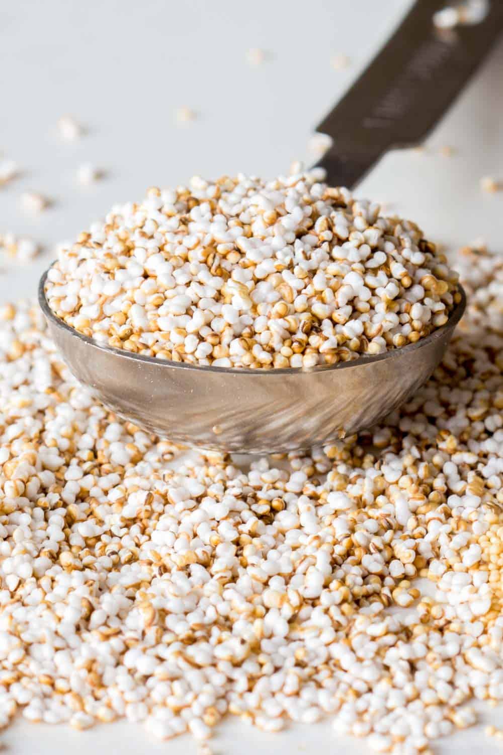 Popped amaranth in a measuring spoon