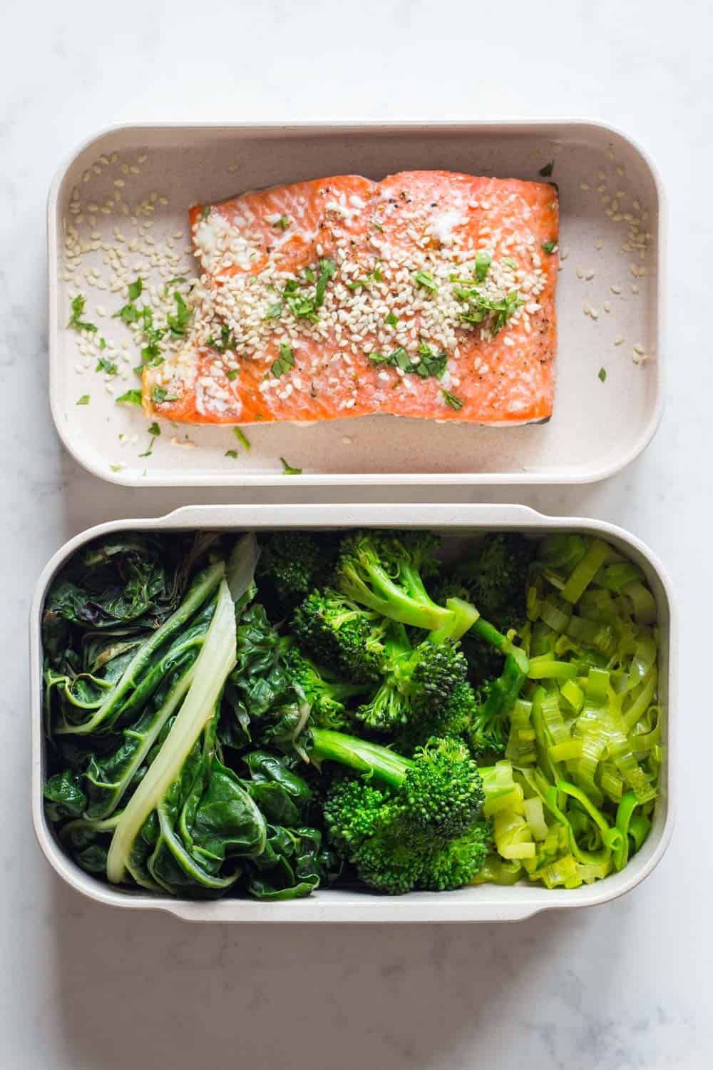A healthy Paleo dinner for your Paleo Meal Plan - Oven-baked salmon fillet served with sautéed leek, broccoli and swiss chard.