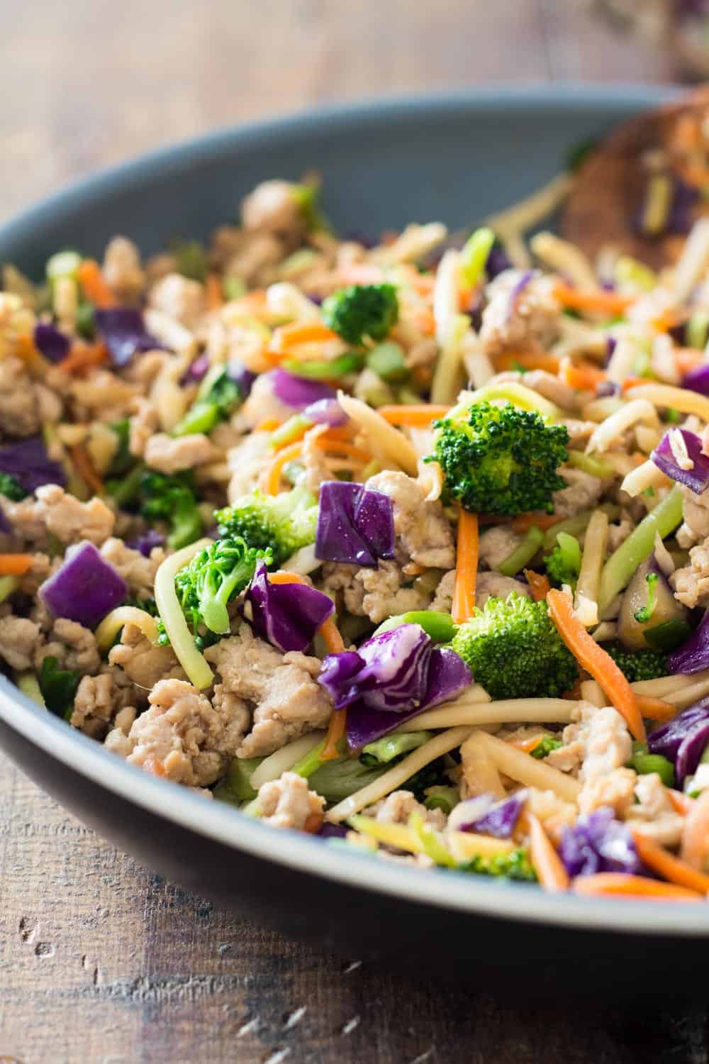 Close up of Low-Carb Stir-Fry showing cooked ground chicken and Mann's Rainbow Salad Veggie Mix.