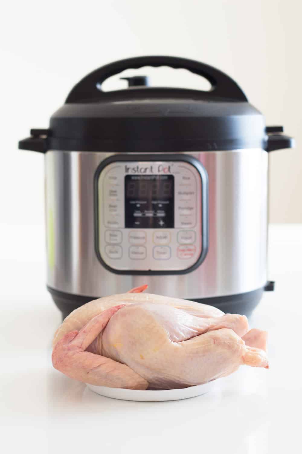 What is the cooking time for cooking whole chicken in Instant Pot Duo 7-in-1  Electric Pressure Cooker?