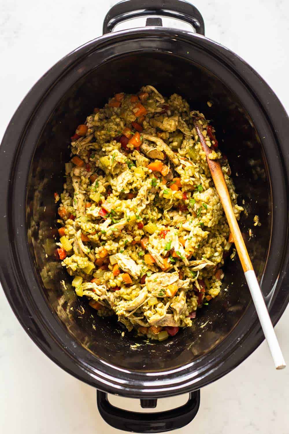 Chicken and Rice in Crock Pot with chicken shreeded and vegetables mixed under