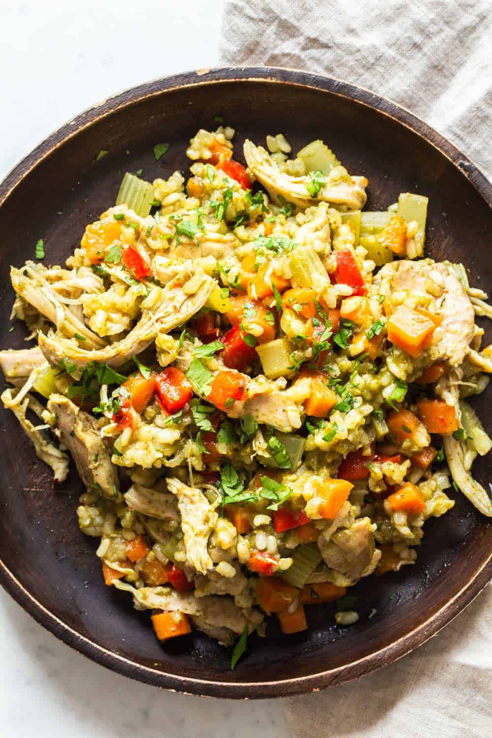 Crock Pot Chicken and Rice on a wooden plate