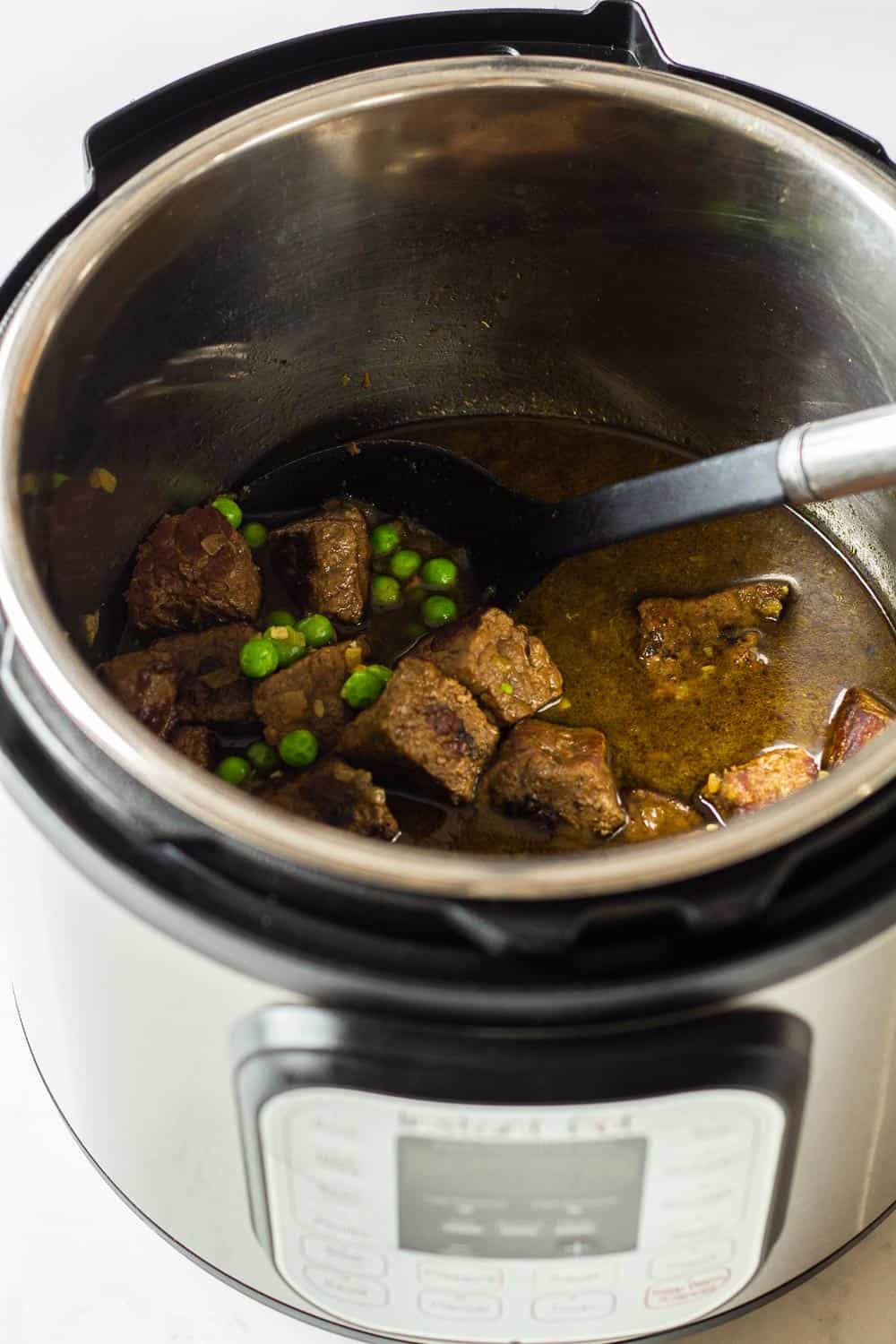 Beef Stew Recipe Instant Pot version shown in the pressure cooker right after opening