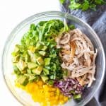 Avocado Chicken Salad deconstructed in a glass bowl