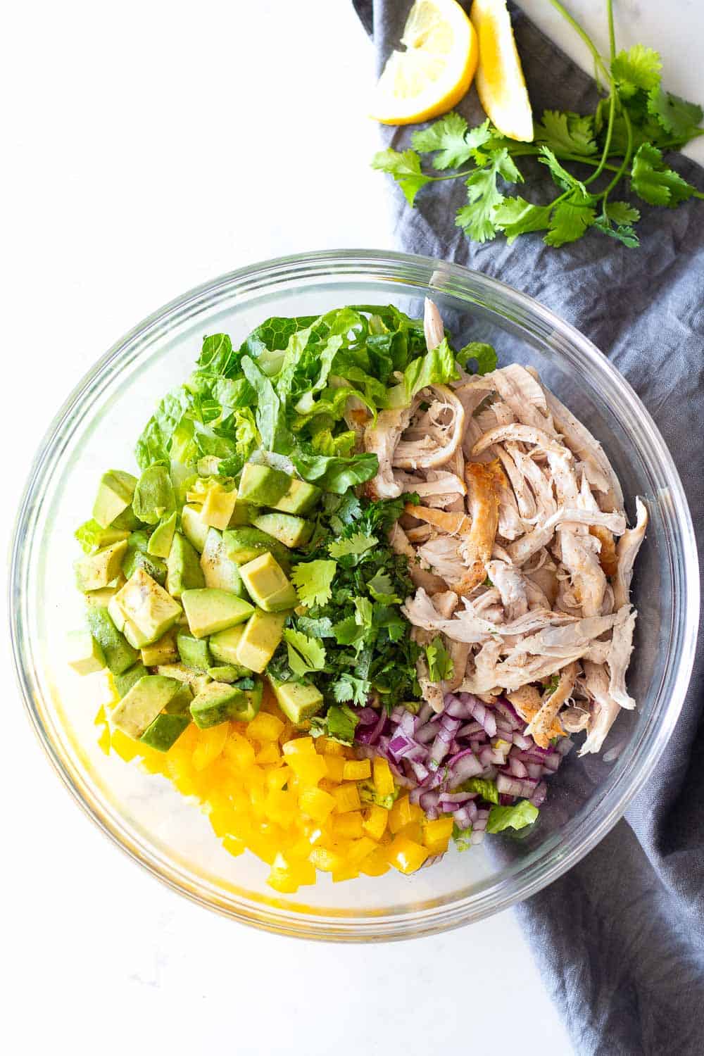 Avocado Chicken Salad deconstructed in a glass bowl