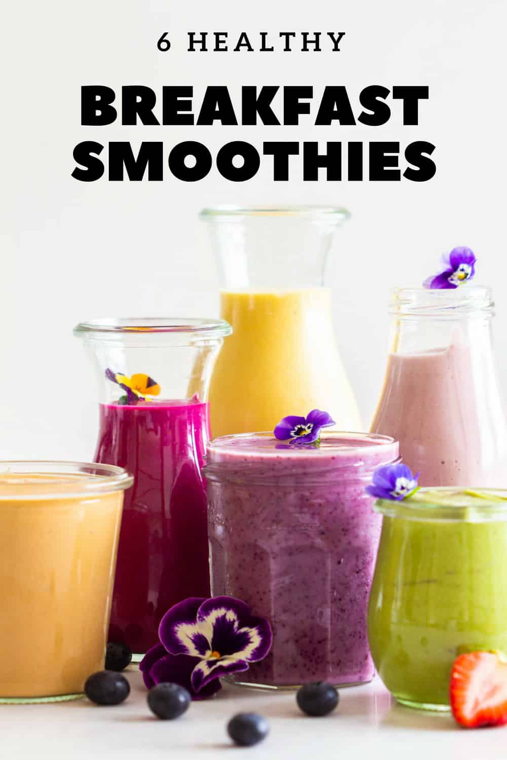 Breakfast Smoothies of all cars in different sized jars and glasses.