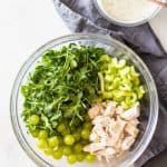 Chicken Salad with Grapes in a large glass bowl with Greek yogurt dressing on the side