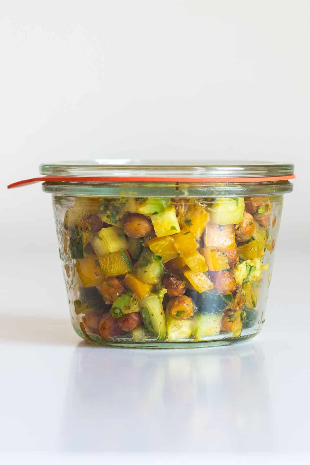 Cucumber Avocado Salad in a clear meal prep container