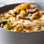 Instant Pot Chicken Wild Rice Soup served in a grey bowl.