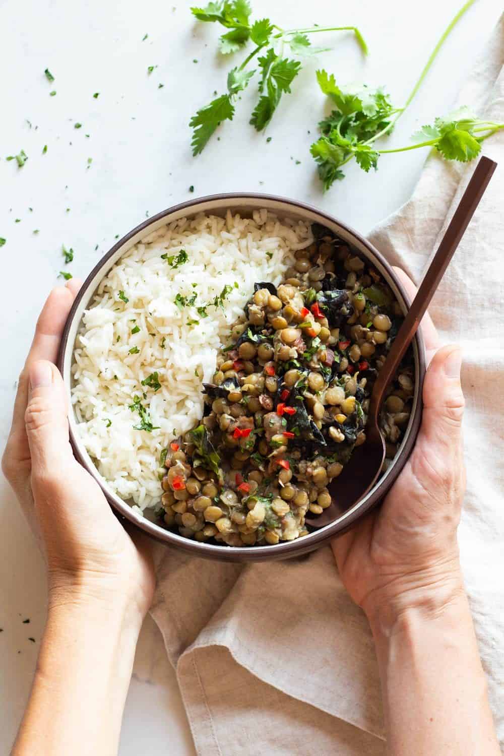 Lentils and Rice in a Bowl held in hands.