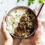 Lentils and Rice in a Bowl held in hands.