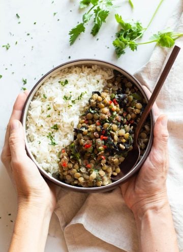 Lentils and Rice in a Bowl held in hands.