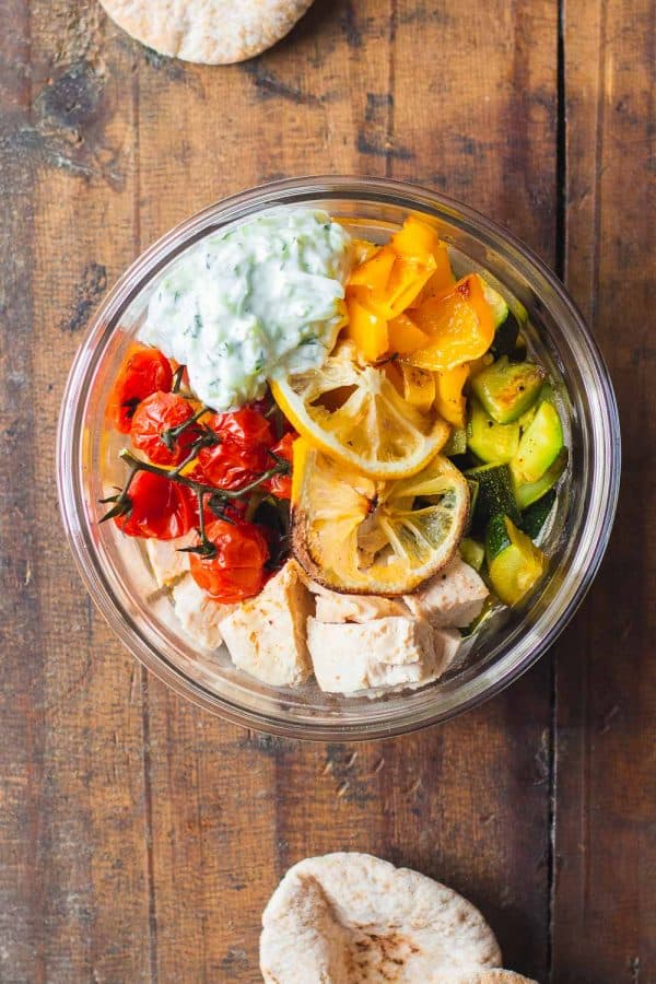 Round Meal Prep Bowl of Greek Chicken with Vegetables and Tzatziki