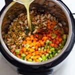 Ingredients for Instant Pot Lentil Soup shown in Pressure Cooker.